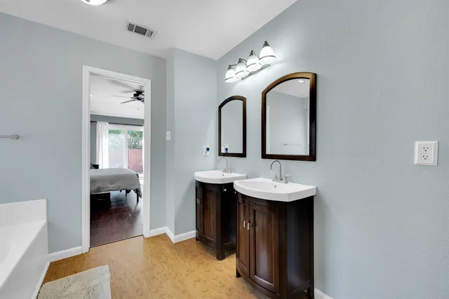 a bathroom with a tub and shower