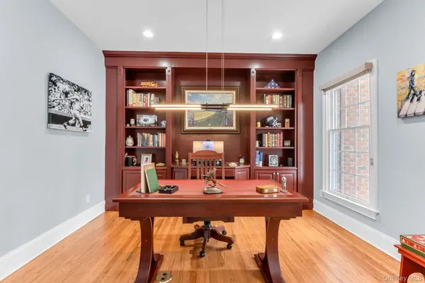 a dining room with table and chairs