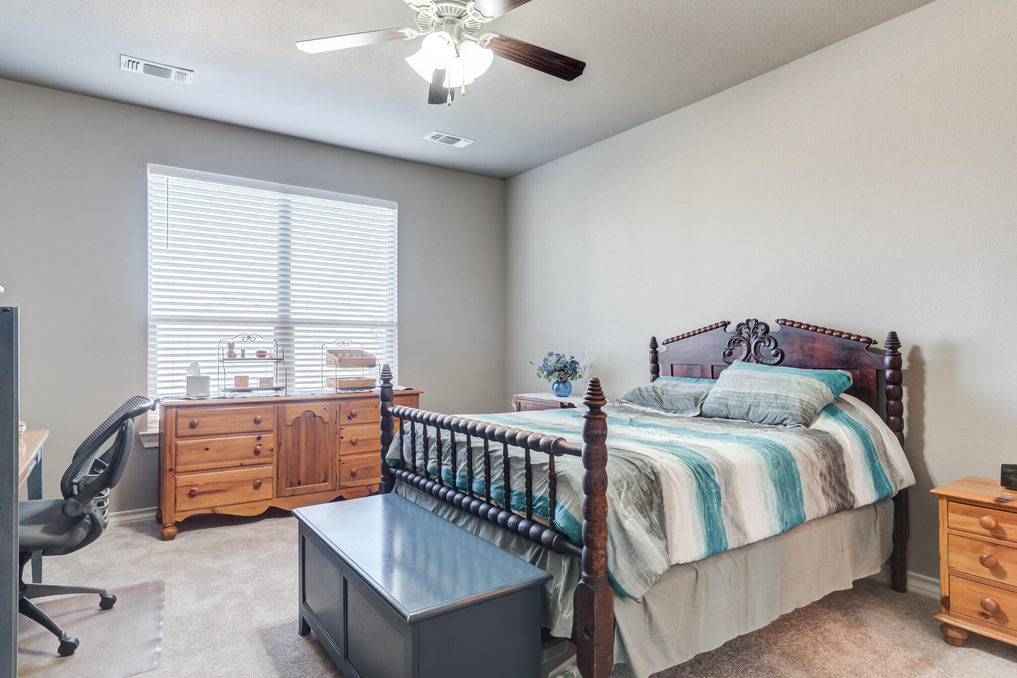 5219 Kemper Street Lubbock, TX 79416 - Photo 20 of 38 a bedroom with bed and window