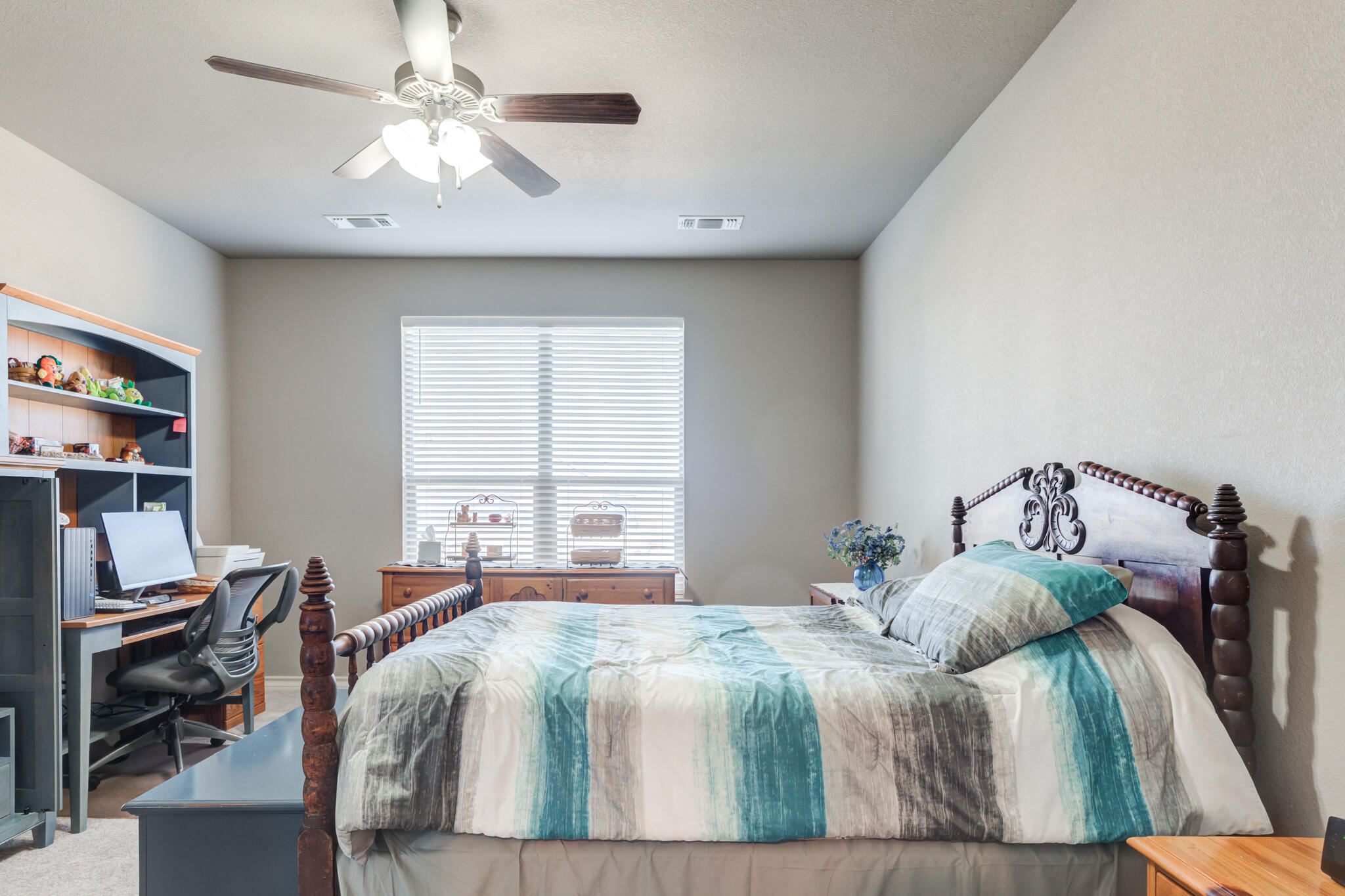 5219 Kemper Street Lubbock, TX 79416 - Photo 22 of 38 a bedroom with a bed and a window