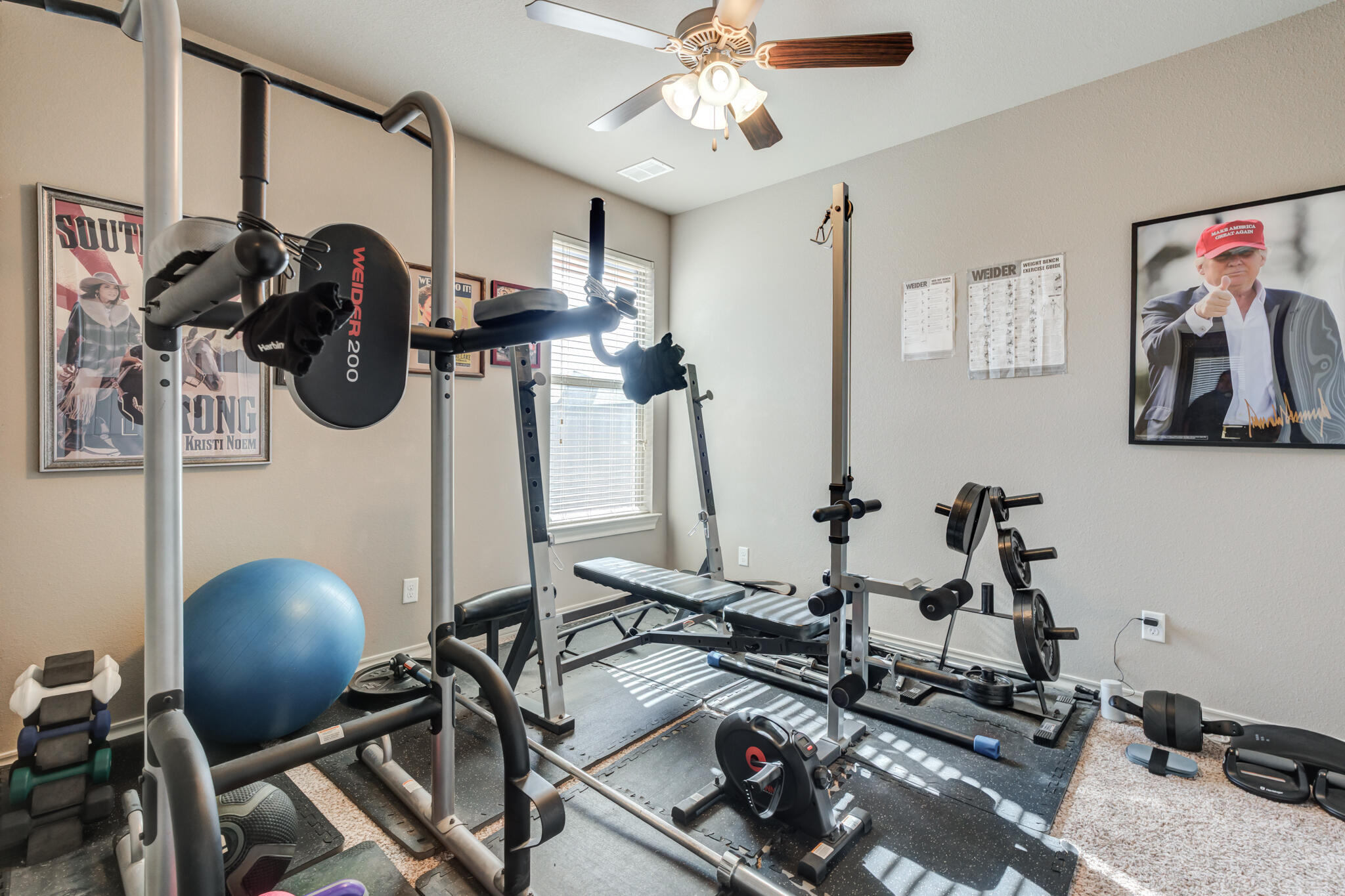 5219 Kemper Street Lubbock, TX 79416 - Photo 33 of 38 a room with gym equipment and windows