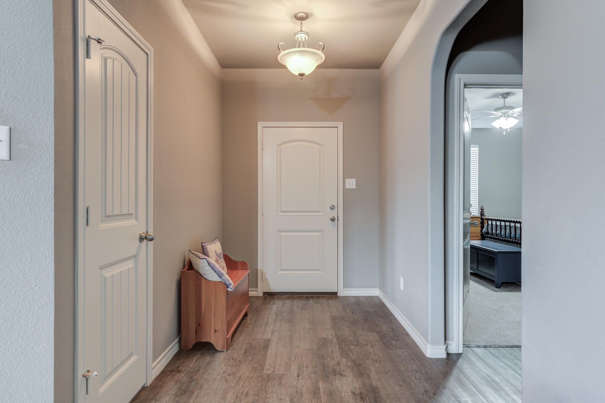 5219 Kemper Street Lubbock, TX 79416 - Photo 8 of 38 a view of a hallway with wooden floor and closet