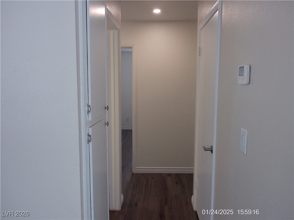 7313 Saybrook Point Drive Las Vegas, NV 89128 - Photo 20 of 31 Hallway with dark wood-type flooring and recessed lighting