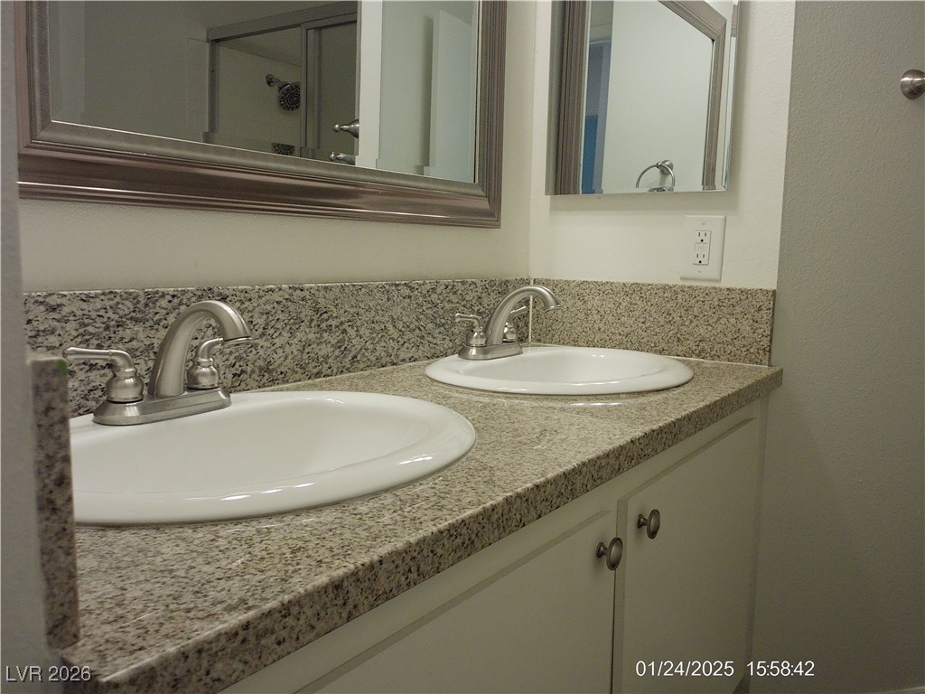 7313 Saybrook Point Drive Las Vegas, NV 89128 - Photo 24 of 31 Bathroom featuring double vanity