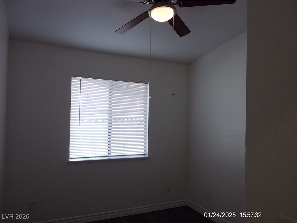 7313 Saybrook Point Drive Las Vegas, NV 89128 - Photo 26 of 31 Spare room with dark wood finished floors and ceiling fan