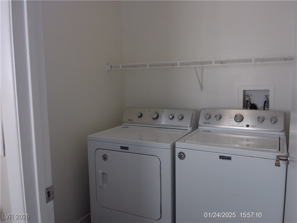 7313 Saybrook Point Drive Las Vegas, NV 89128 - Photo 27 of 31 Laundry room featuring washing machine and dryer