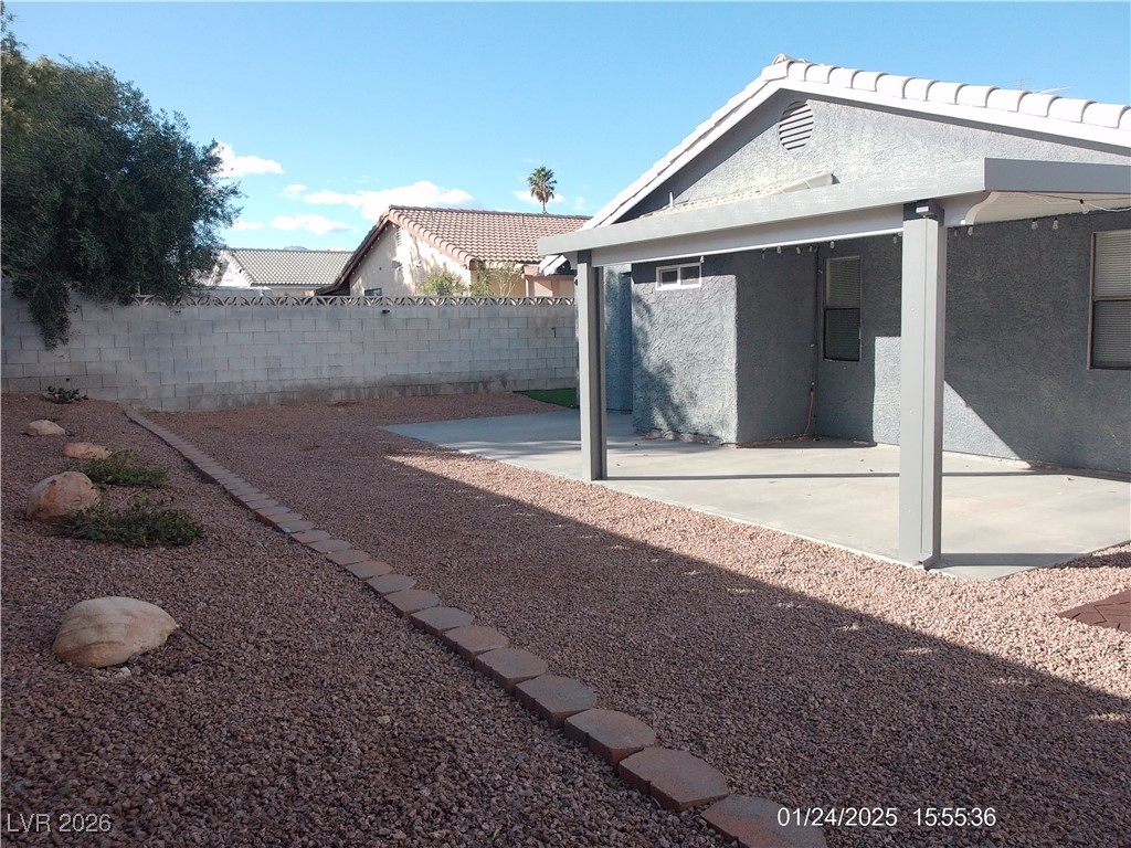 7313 Saybrook Point Drive Las Vegas, NV 89128 - Photo 30 of 31 Fenced backyard with a patio area