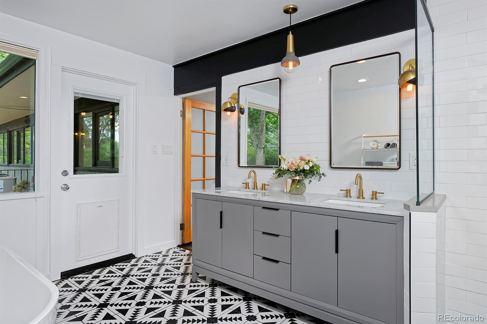 260 Ridge Road Boulder, CO 80303 - Photo 23 of 40 a bathroom with a double vanity sink and mirror