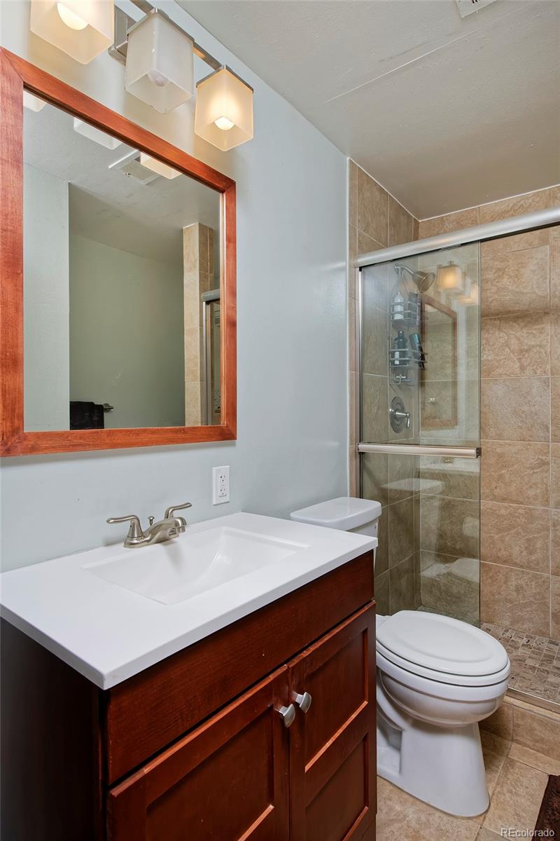 260 Ridge Road Boulder, CO 80303 - Photo 36 of 40 a bathroom with a sink vanity mirror and toilet