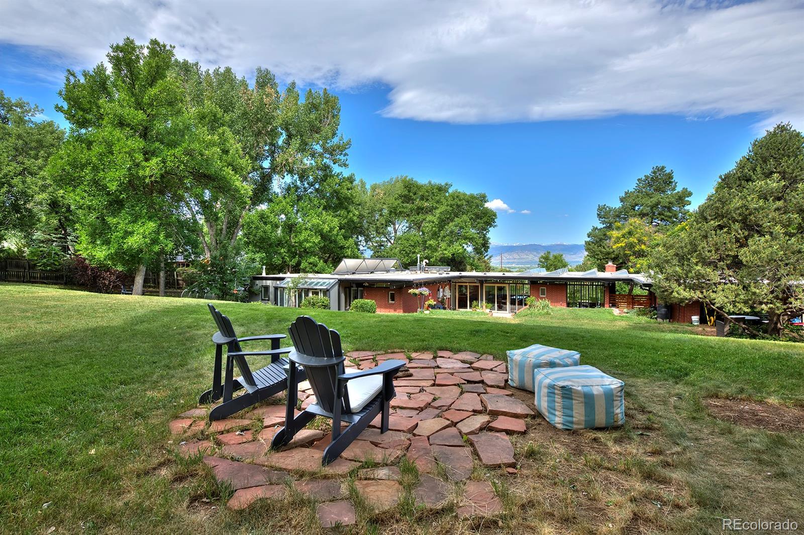 260 Ridge Road Boulder, CO 80303 - Photo 40 of 40 a view of a chair and table on the green field