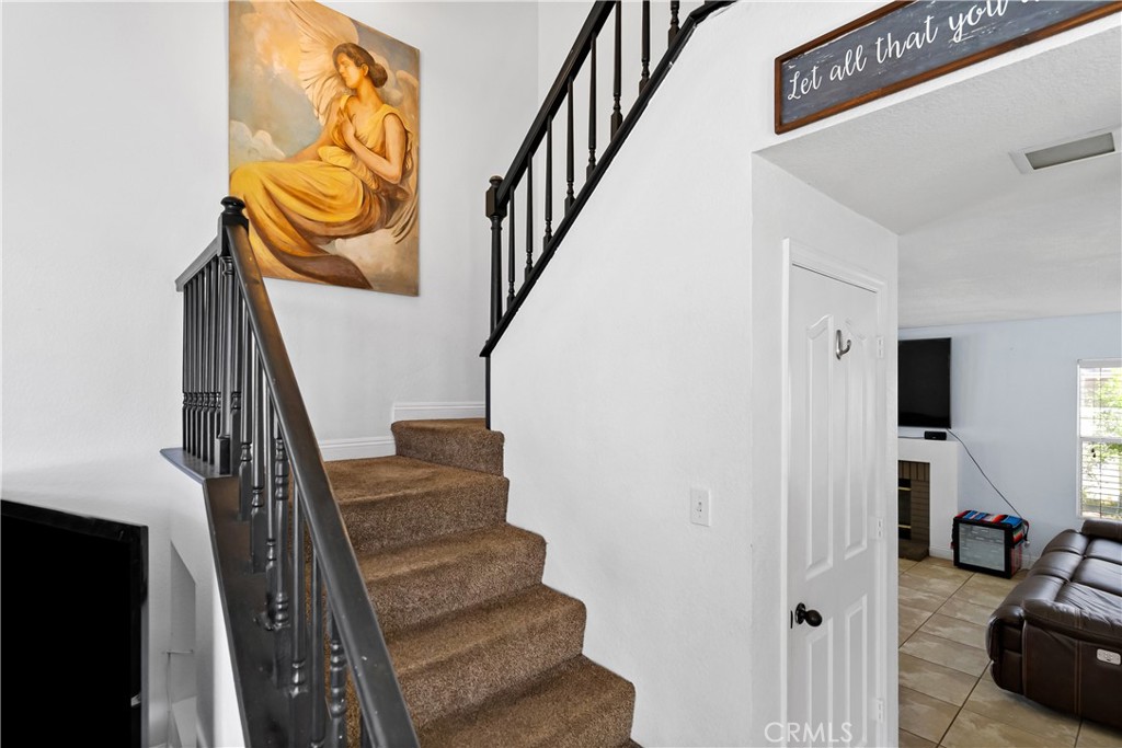 9321 Loquat Drive Riverside, CA 92508 - Photo 20 of 39 a view of entryway and hall with wooden floor