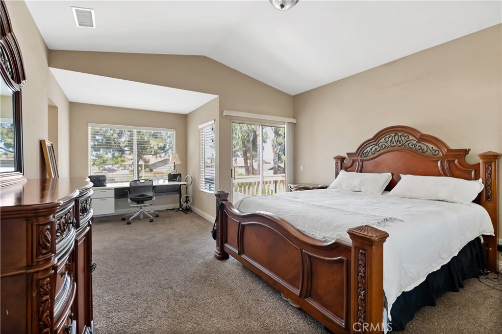 9321 Loquat Drive Riverside, CA 92508 - Photo 21 of 39 a bed room with a bed and a chair