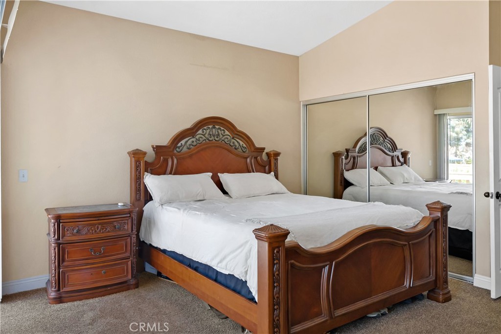 9321 Loquat Drive Riverside, CA 92508 - Photo 23 of 39 a bedroom with a bed and a dresser