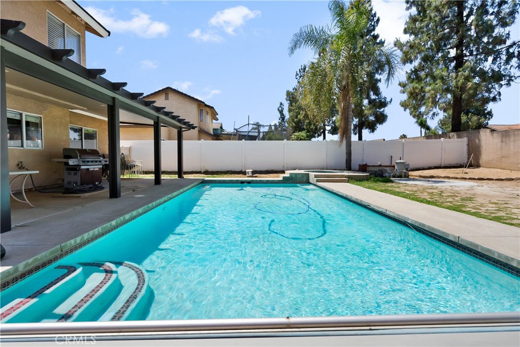 9321 Loquat Drive Riverside, CA 92508 - Photo 33 of 39 a view of a backyard with a patio