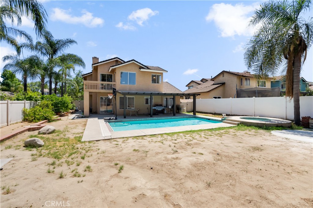 9321 Loquat Drive Riverside, CA 92508 - Photo 35 of 39 a front view of a house with a yard and garage