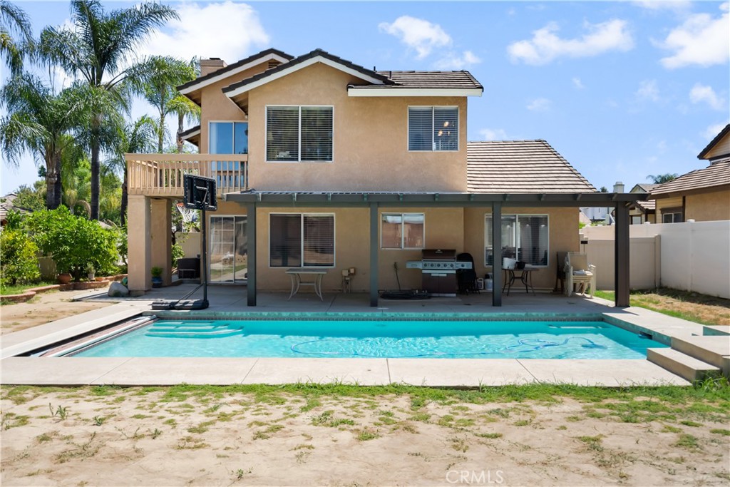 9321 Loquat Drive Riverside, CA 92508 - Photo 36 of 39 a front view of a house with a yard