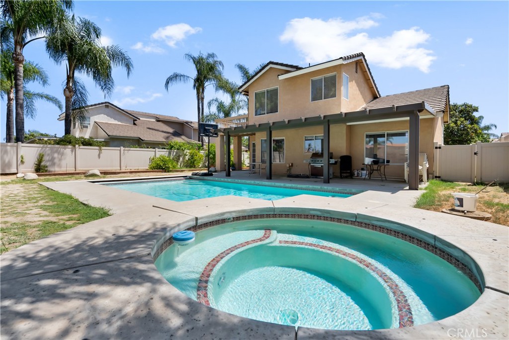 9321 Loquat Drive Riverside, CA 92508 - Photo 37 of 39 a view of a house with a swimming pool
