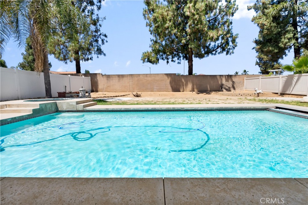 9321 Loquat Drive Riverside, CA 92508 - Photo 38 of 39 a view of swimming pool with a yard