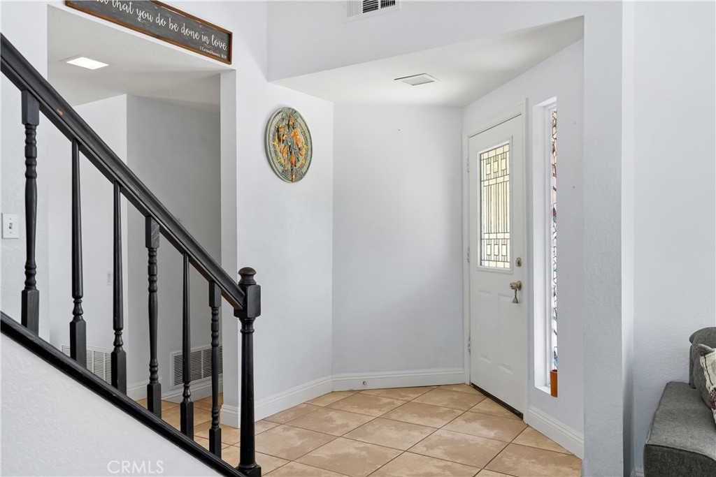 9321 Loquat Drive Riverside, CA 92508 - Photo 6 of 39 a view of an entryway with wooden floor