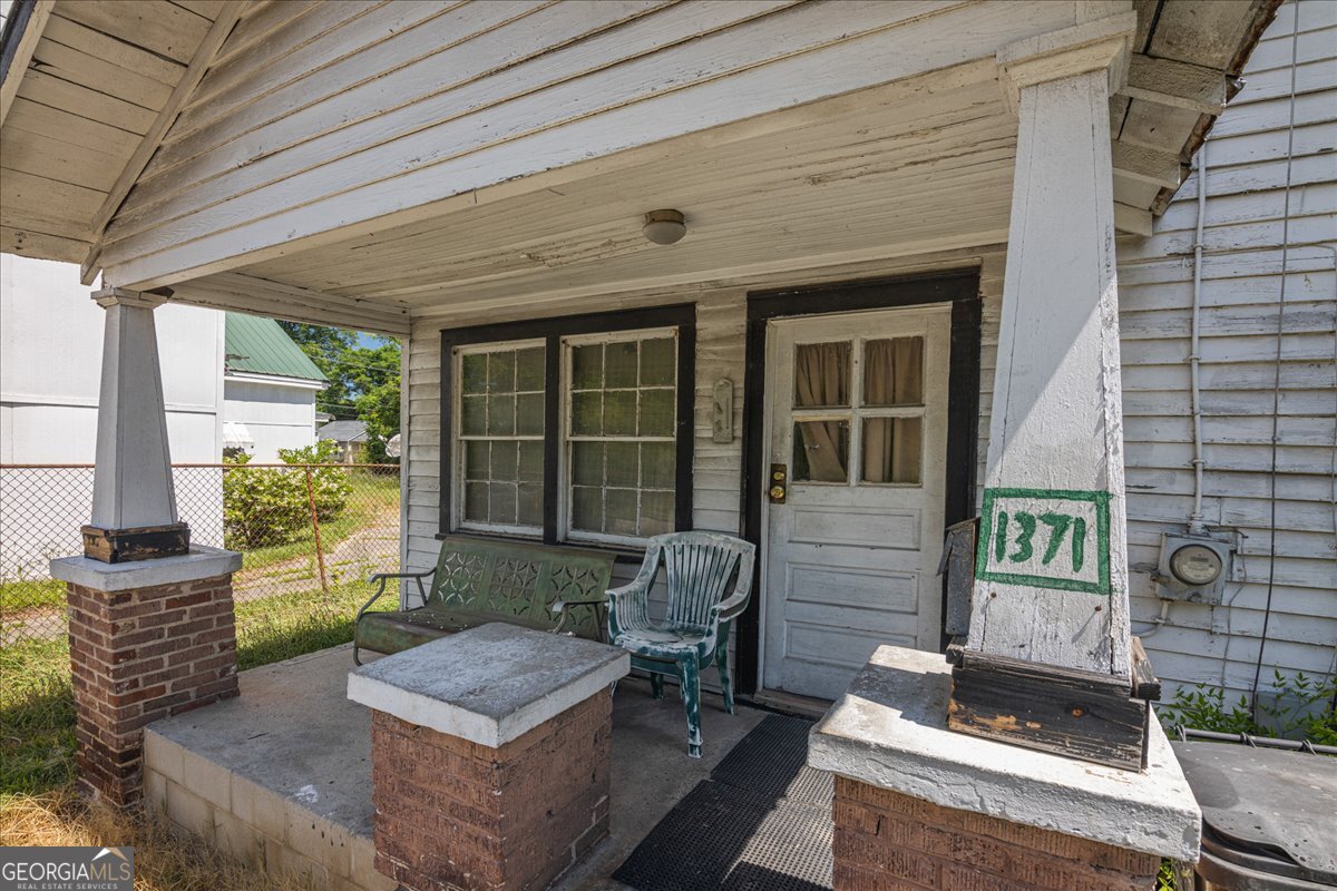 1367 Wrightsboro Road Augusta, GA 30901 - Photo 19 of 49 a front view of a house with outdoor seating