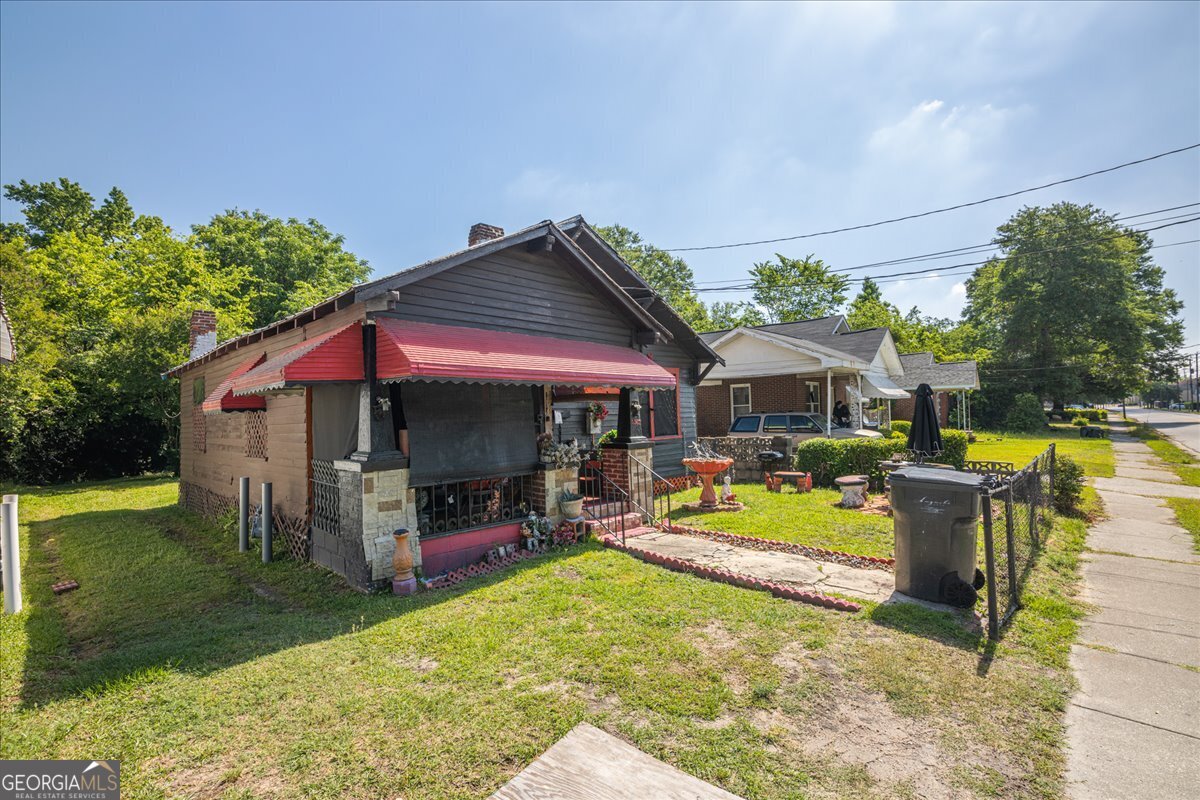 1367 Wrightsboro Road Augusta, GA 30901 - Photo 36 of 49 a view of a house with swimming pool and sitting area