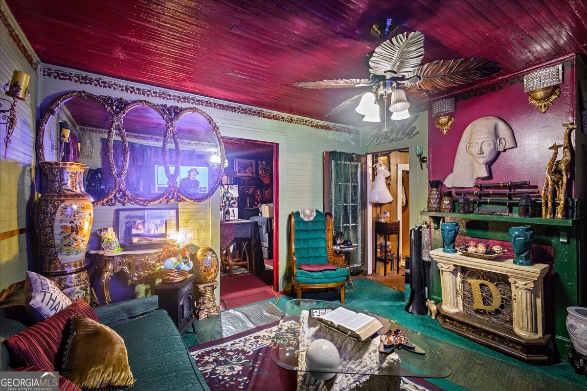 1367 Wrightsboro Road Augusta, GA 30901 - Photo 39 of 49 a living room with lots of furniture and a fireplace