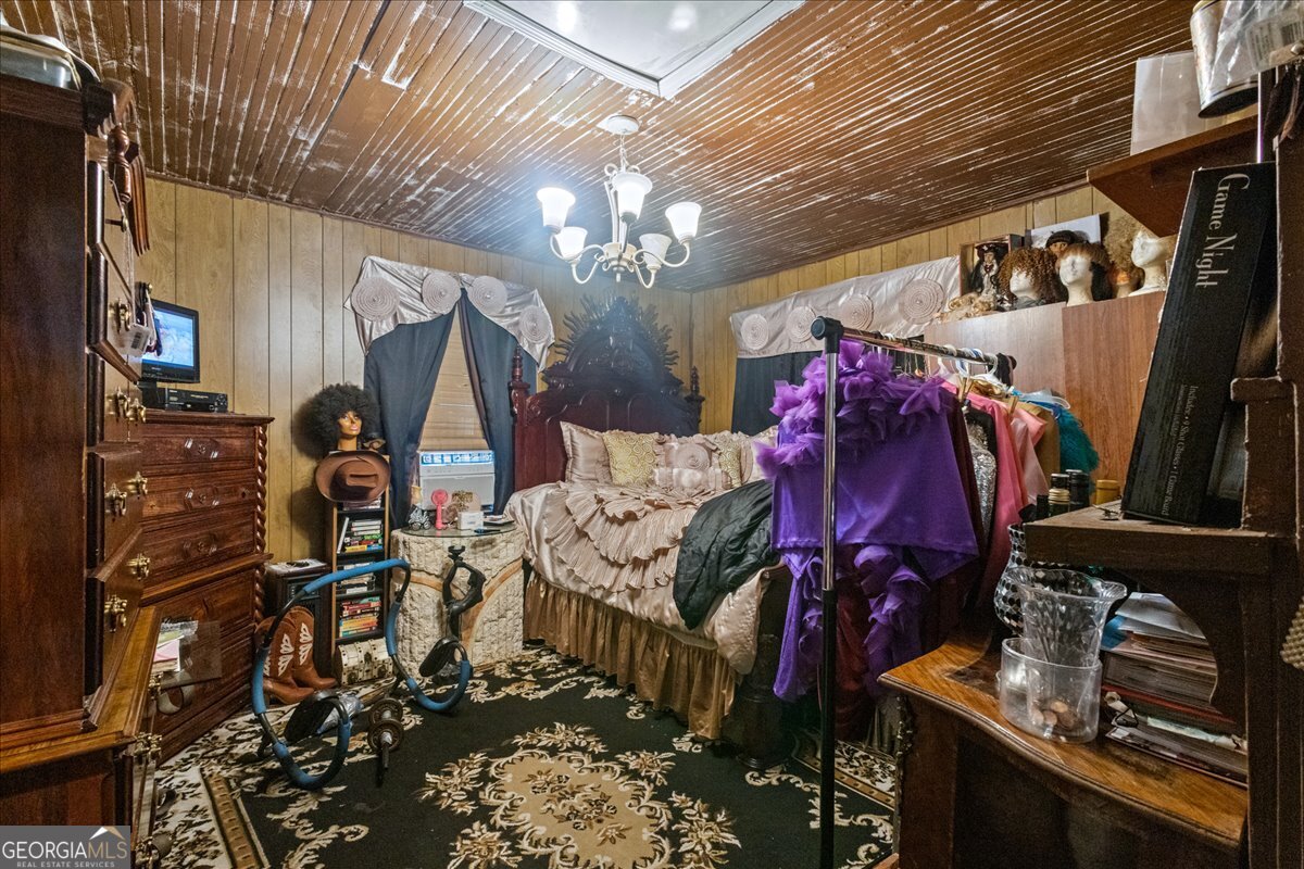 1367 Wrightsboro Road Augusta, GA 30901 - Photo 42 of 49 a view of walk in closet with clothes and shoes