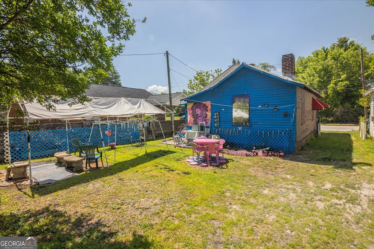 1367 Wrightsboro Road Augusta, GA 30901 - Photo 47 of 49 a view of a house with swimming pool and sitting area