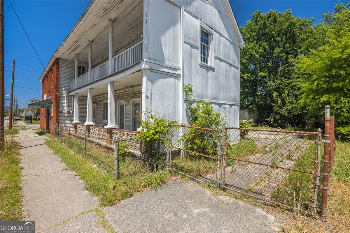 1367 Wrightsboro Road Augusta, GA 30901 - Photo 7 of 49 a view of a building with potted plants
