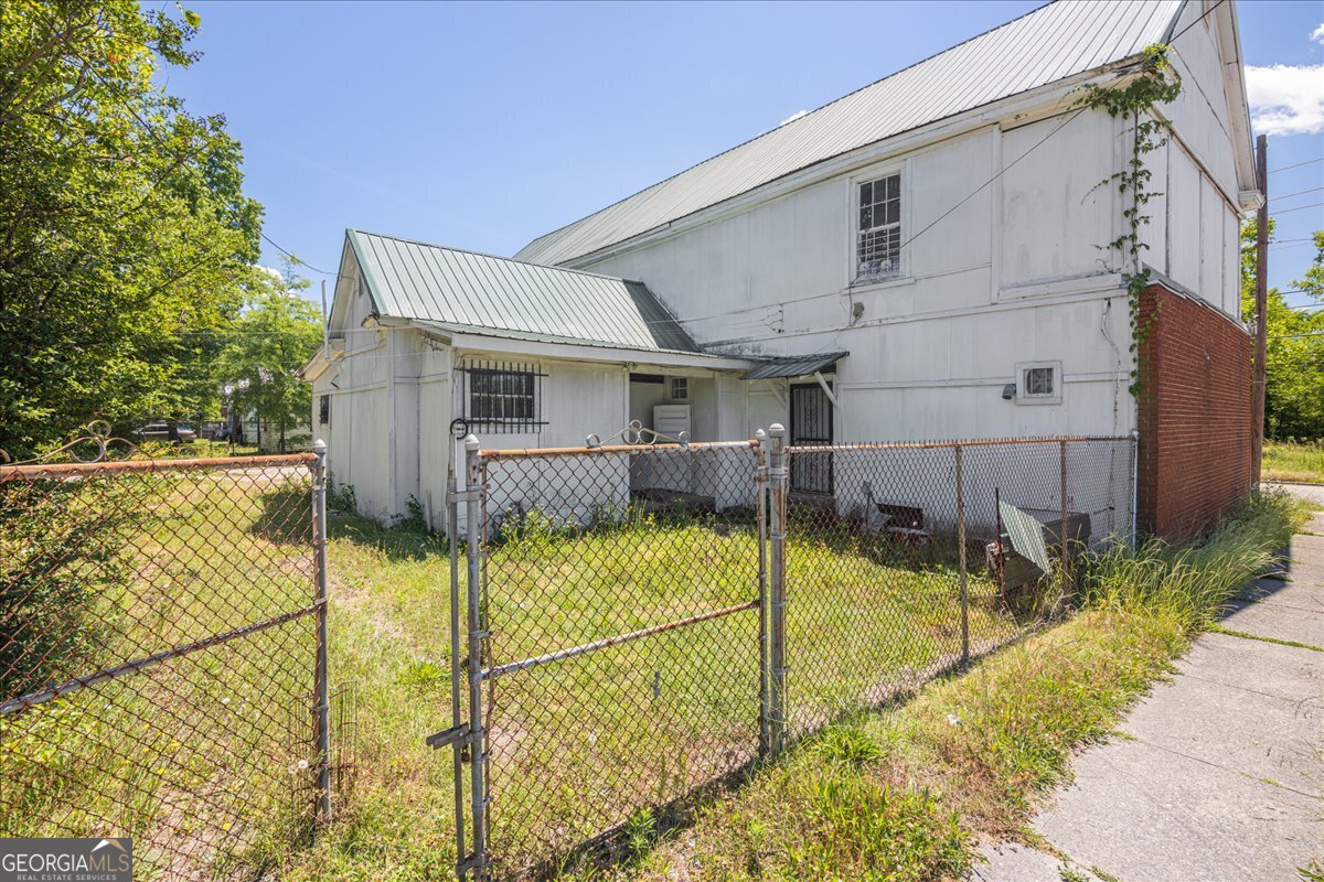 1367 Wrightsboro Road Augusta, GA 30901 - Photo 10 of 49 a view of house with backyard