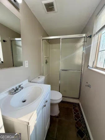 a bathroom with a sink and a toilet