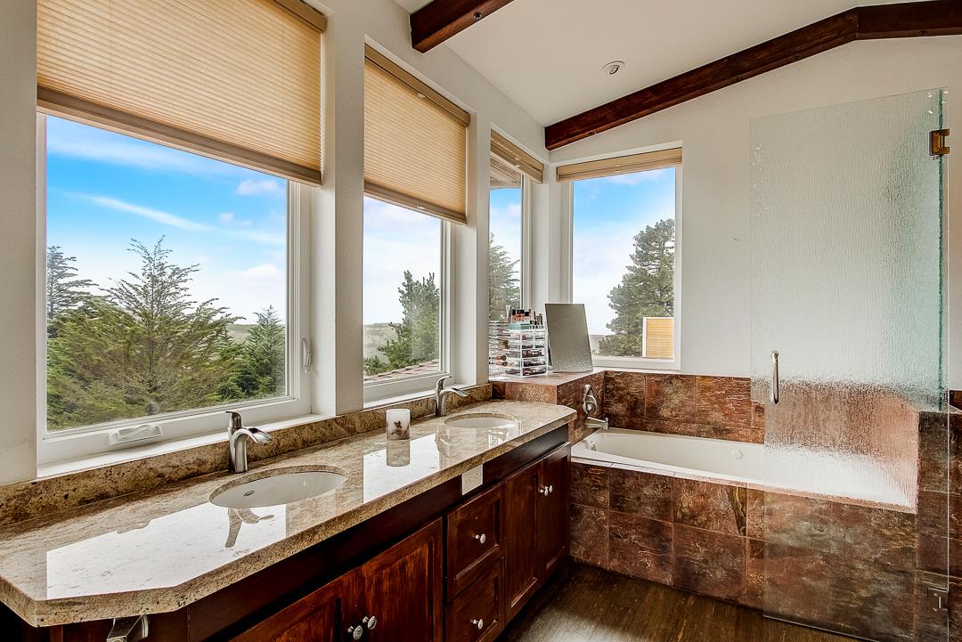 776 Lockhaven Drive Pacifica, CA 94044 - Photo 27 of 49 a spacious bathroom with sinks and a large mirror