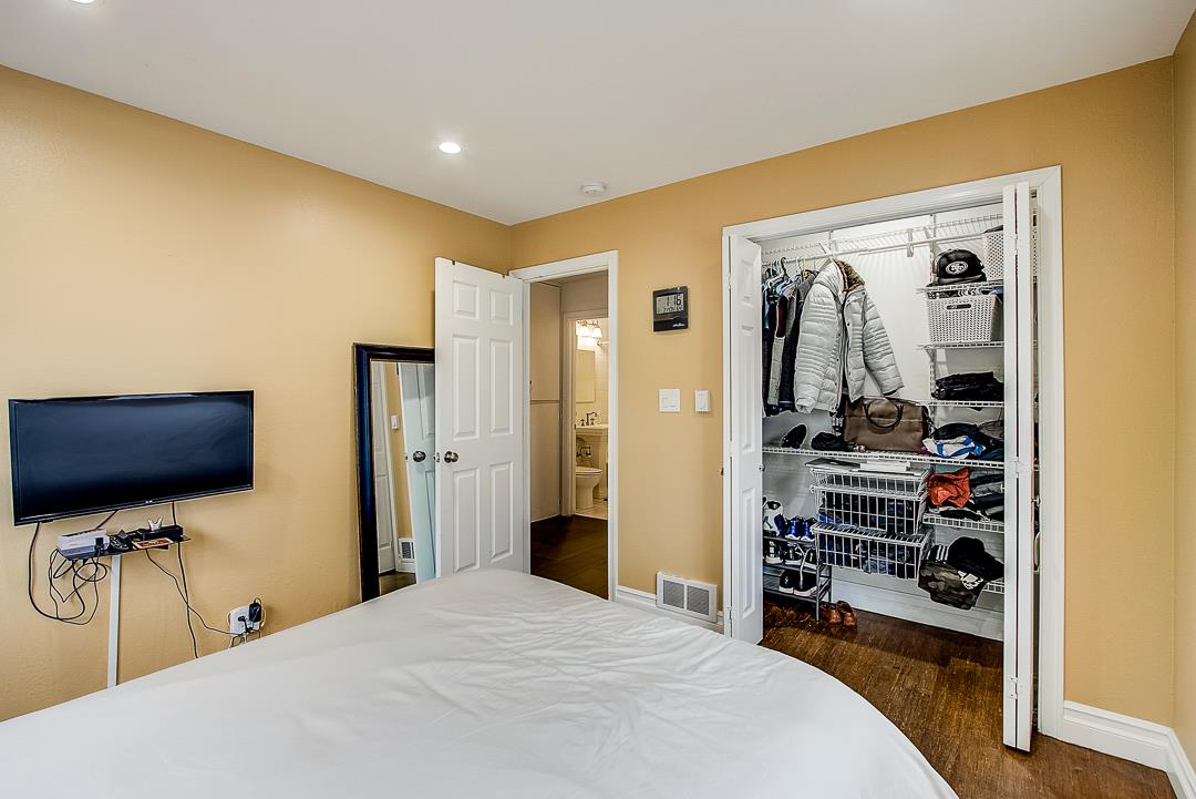 776 Lockhaven Drive Pacifica, CA 94044 - Photo 33 of 49 a bedroom with a bed and a flat screen tv