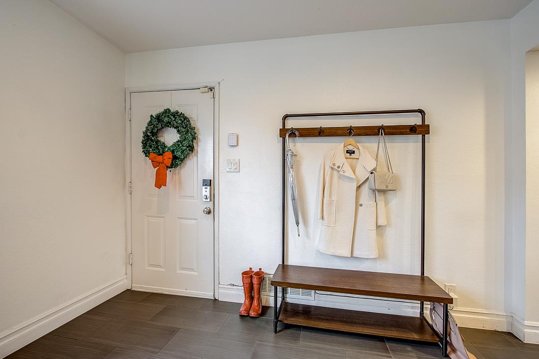 776 Lockhaven Drive Pacifica, CA 94044 - Photo 5 of 49 a hallway with painting on the wall