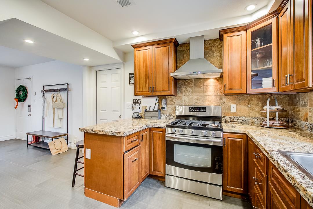 776 Lockhaven Drive Pacifica, CA 94044 - Photo 10 of 49 a kitchen with a stove and a sink