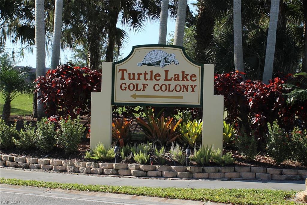 400 Forest Lakes Boulevard, Unit 309 Naples, FL 34105 - Photo 1 of 12 a sign on the side of a building