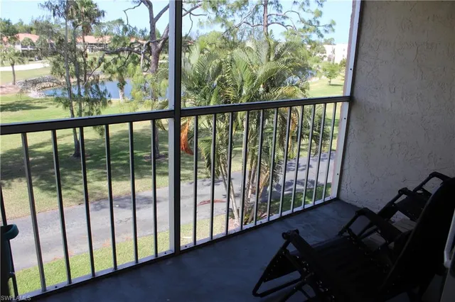 a view of a balcony with chairs
