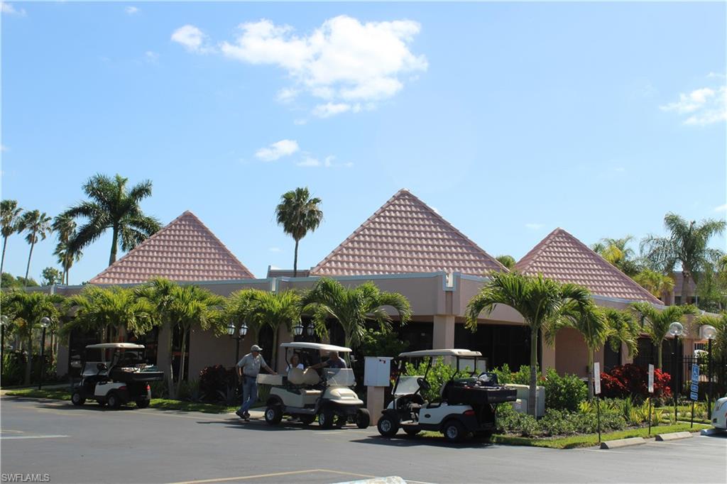 400 Forest Lakes Boulevard, Unit 309 Naples, FL 34105 - Photo 2 of 12 a couple of cars parked in front of a house