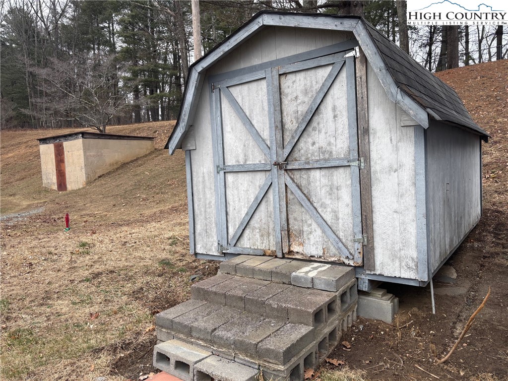 88 Grandridge Road Sparta, NC 28675 - Photo 12 of 21 a house with trees in front of it