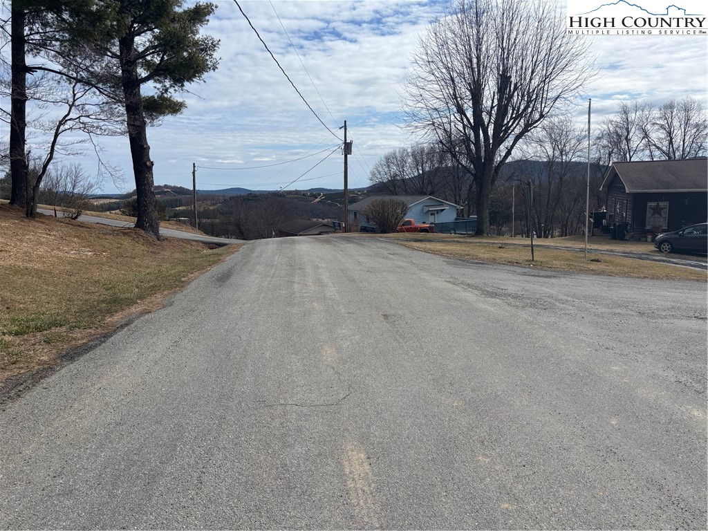 88 Grandridge Road Sparta, NC 28675 - Photo 16 of 21 a view of road with large trees
