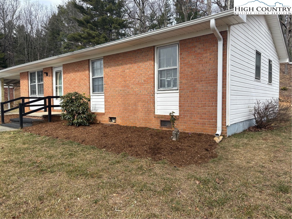88 Grandridge Road Sparta, NC 28675 - Photo 19 of 21 a view of backyard with deck and garden