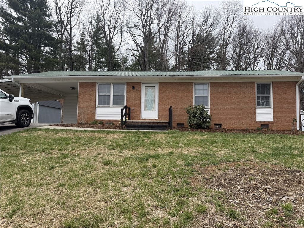 88 Grandridge Road Sparta, NC 28675 - Photo 20 of 21 front view of a house with a yard