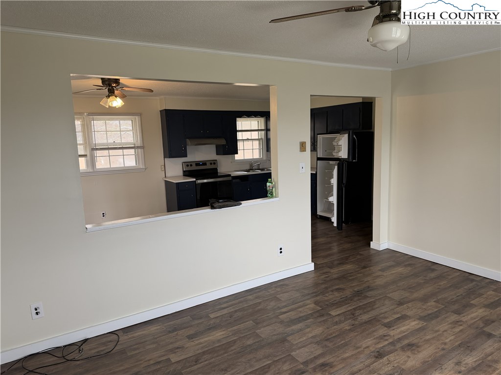 88 Grandridge Road Sparta, NC 28675 - Photo 5 of 21 an empty room with wooden floor and windows