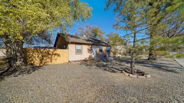 a view of a house with a tree
