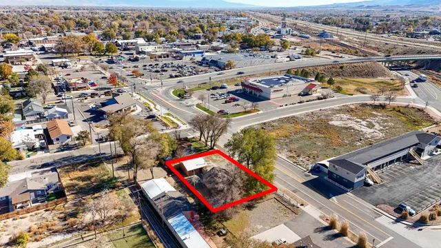 an aerial view of residential houses with city view