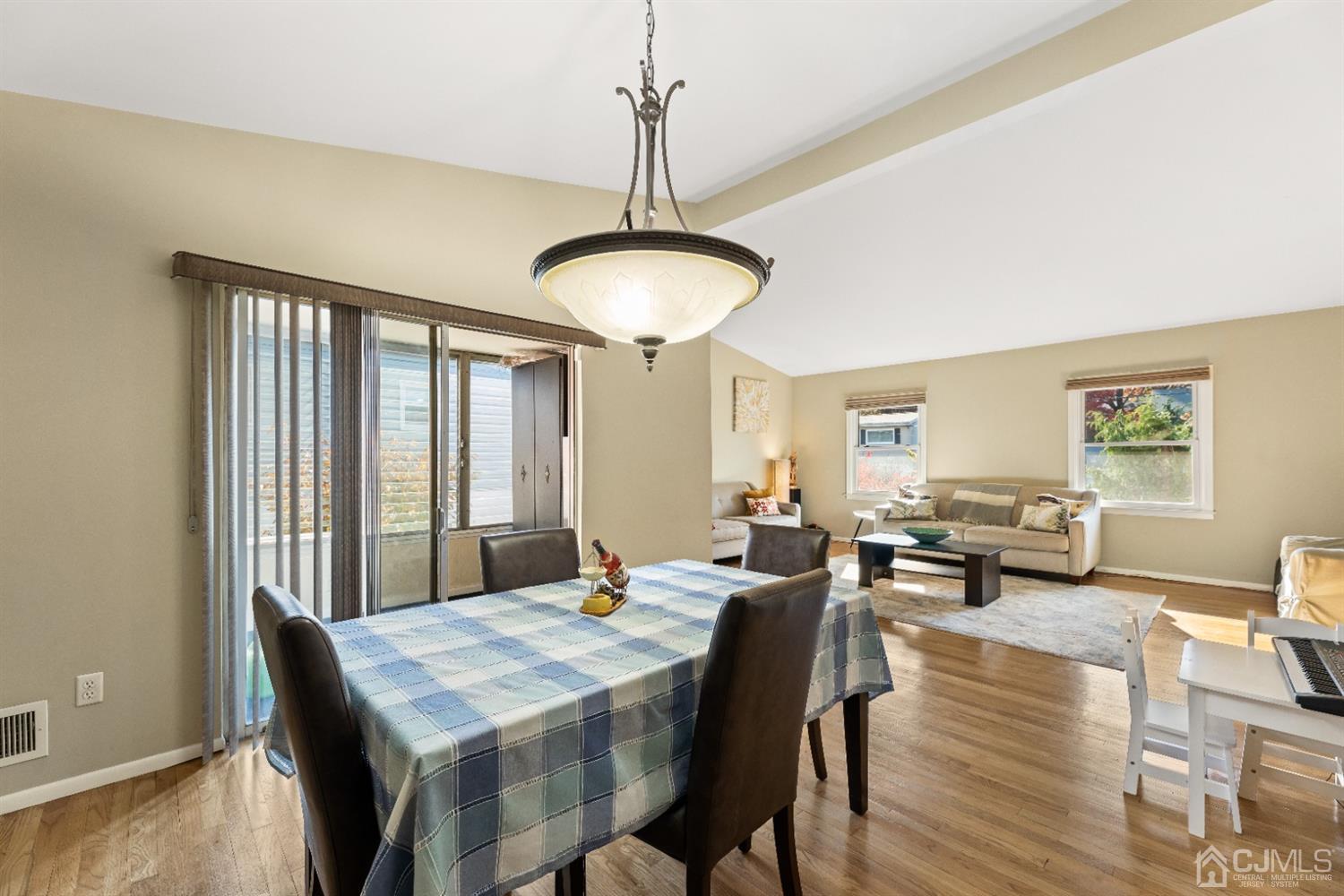 50 Wilk Road Edison, NJ 08837 - Photo 11 of 27 a view of a a dining room with furniture window and wooden floor