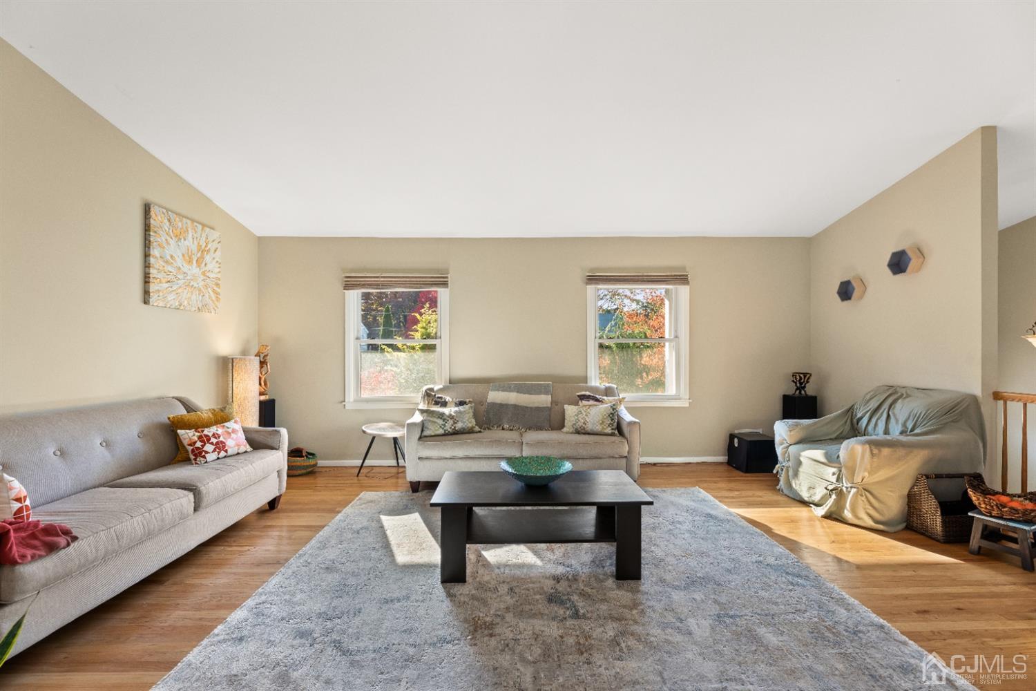 50 Wilk Road Edison, NJ 08837 - Photo 14 of 27 a living room with furniture and a table