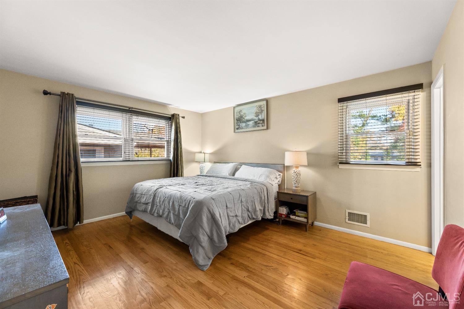50 Wilk Road Edison, NJ 08837 - Photo 16 of 27 a bedroom with a bed and wooden floor