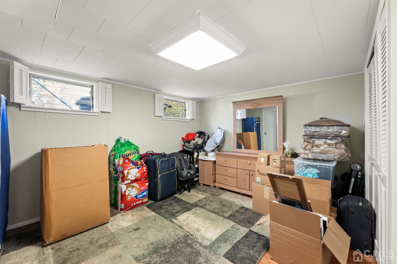 50 Wilk Road Edison, NJ 08837 - Photo 17 of 27 a bed room with a bed a couch and a window