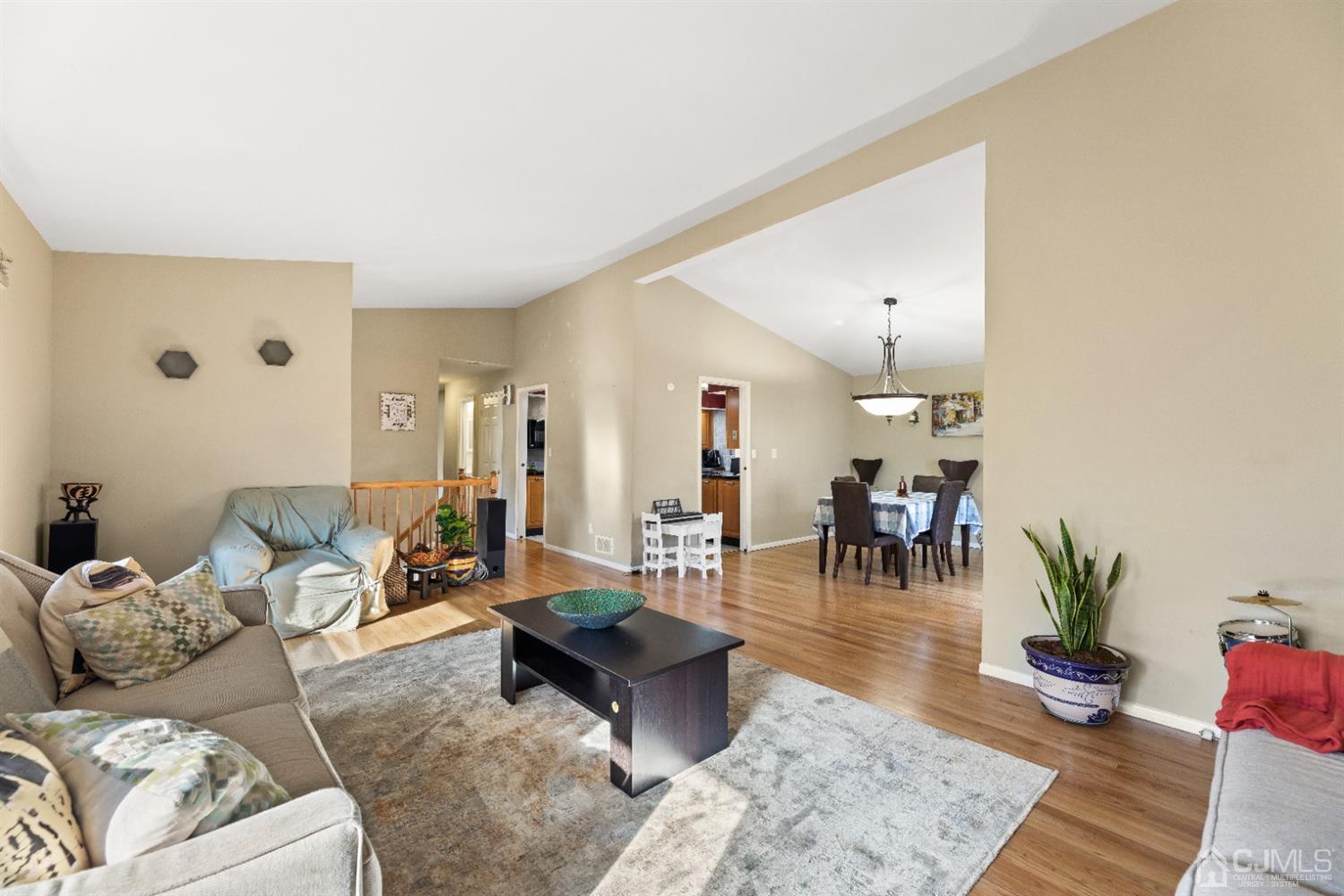 50 Wilk Road Edison, NJ 08837 - Photo 22 of 27 a living room with furniture and a potted plant